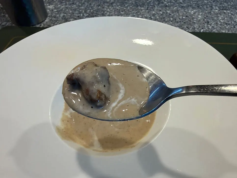 Warm soup made with chestnut and button mushroom