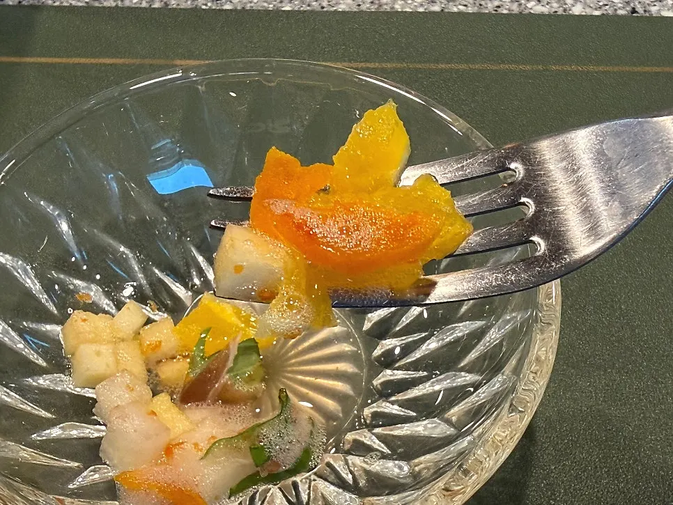 Salad topped with a persimmon vinegar and grapefruit foam sauce