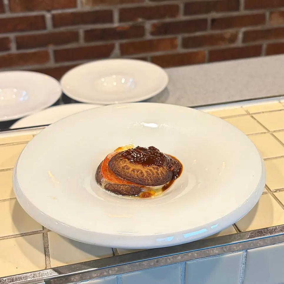 Cross-section of a bite-sized cut of the shiitake mushroom lasagna