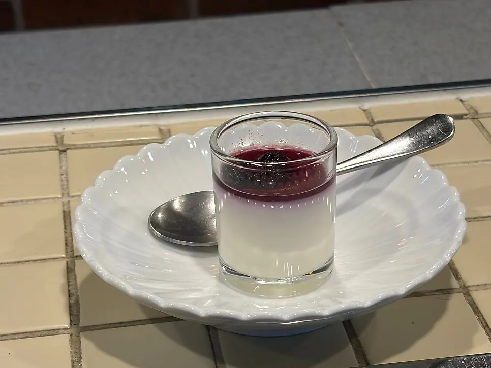 Milk pudding dessert topped with blueberries