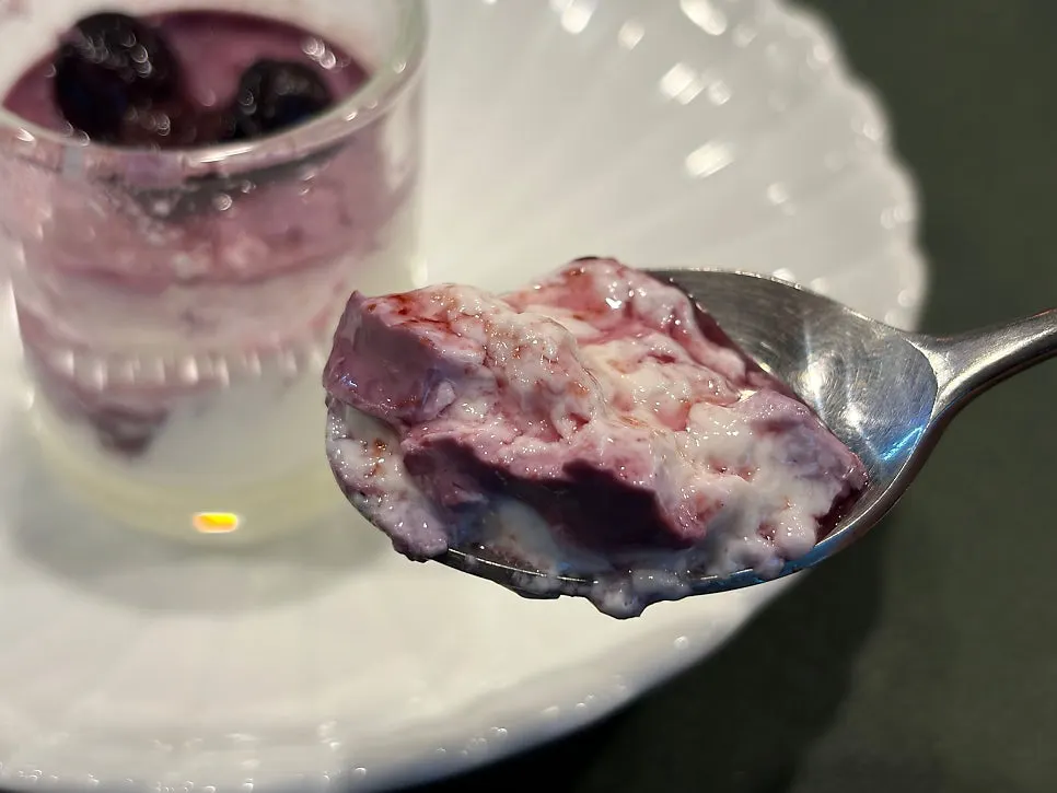 A spoonful scooped from the milk pudding