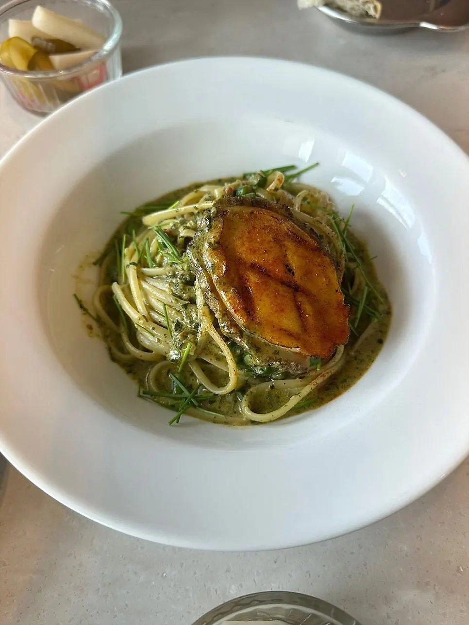 Abalone geu pasta topped with plump abalone