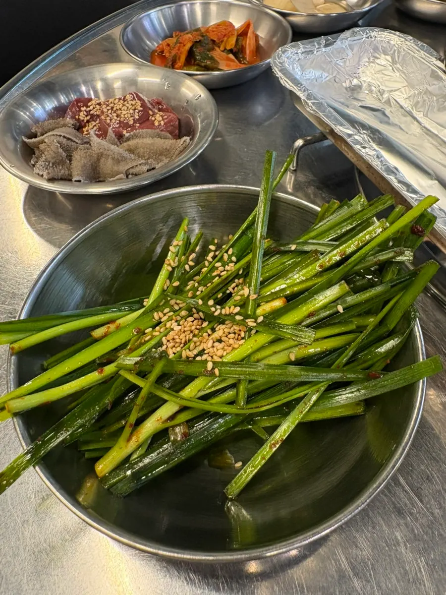 Table setting and basic side dishes at the gopchang restaurant