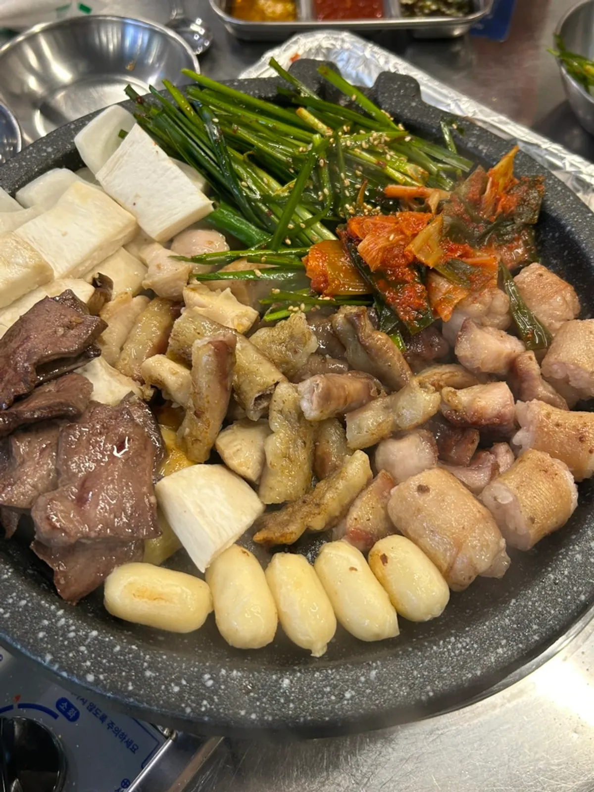 Beef gopchang grilling on the hot plate