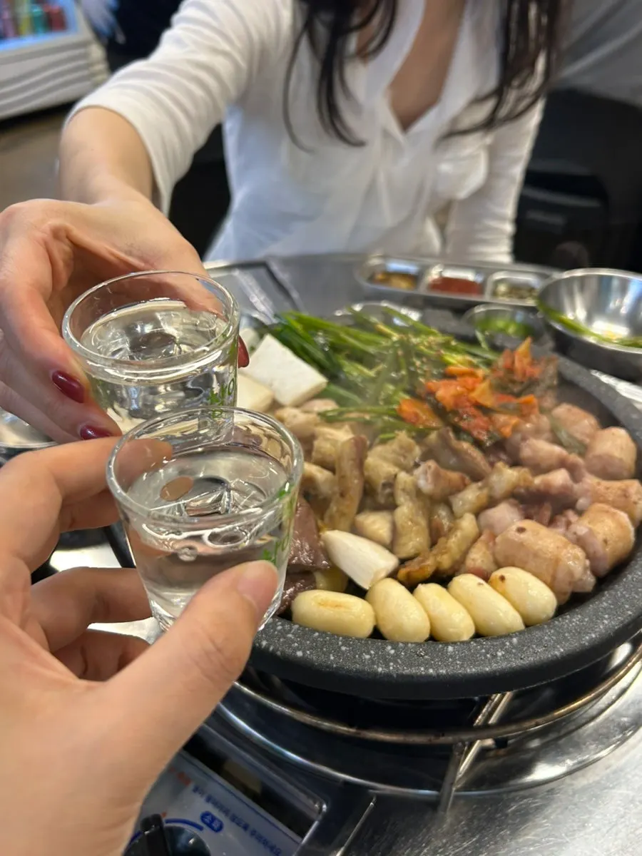 Fully cooked mixed gopchang platter on the grill