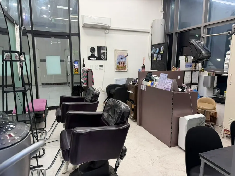 Treatment price list posted outside Marker Hair