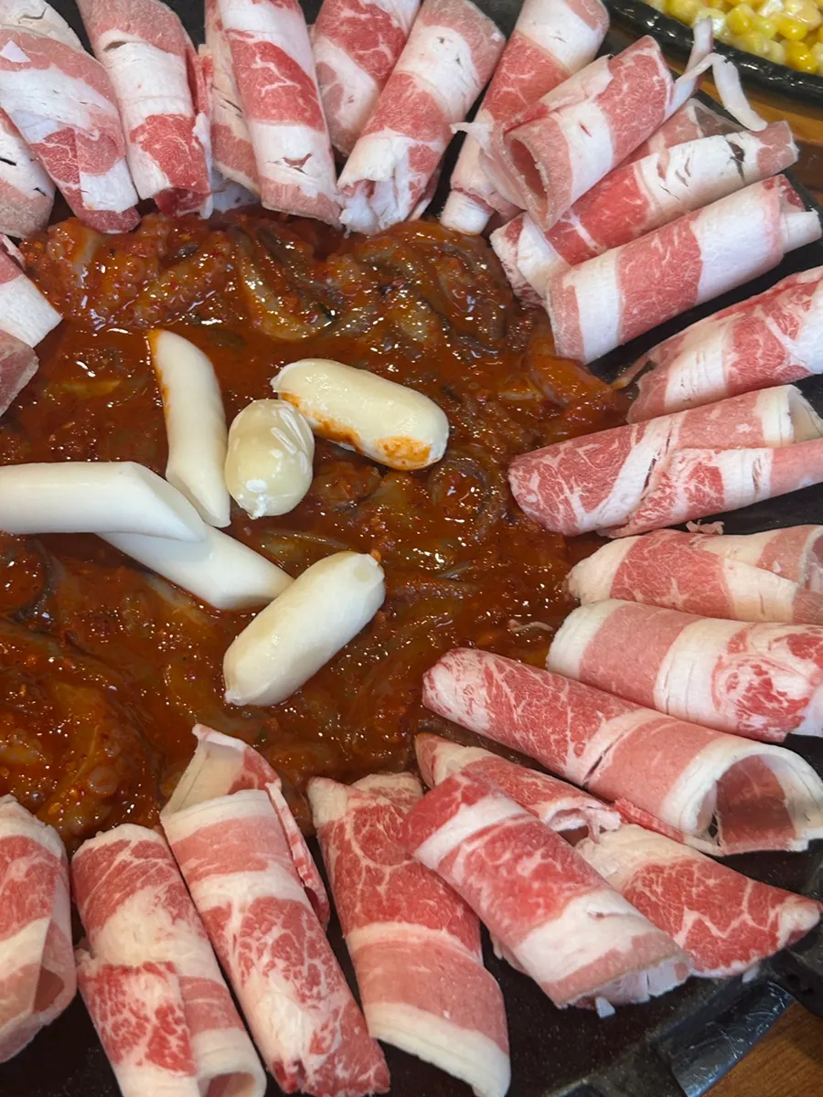 Jjukkumi with beef brisket, bean sprouts, and rice cakes