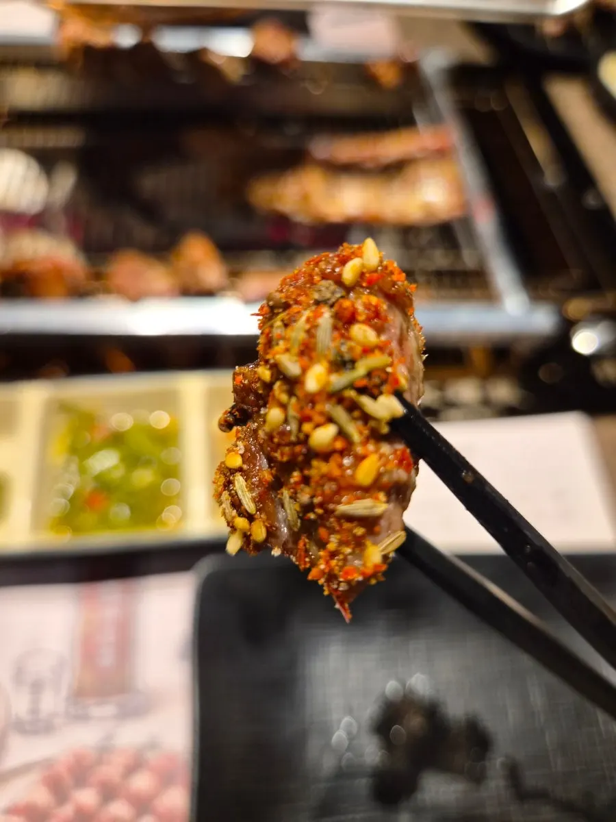 Lamb skewers on an automatic rotating grill
