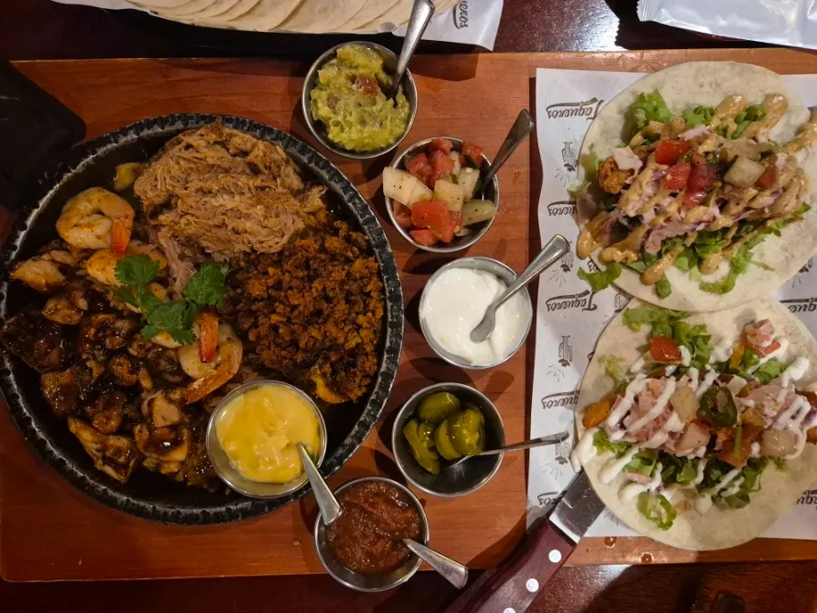 The couple set spread with three kinds of meat and shrimp