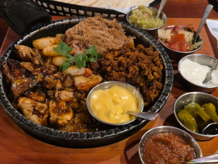 The couple set plate served with an assortment of sauces
