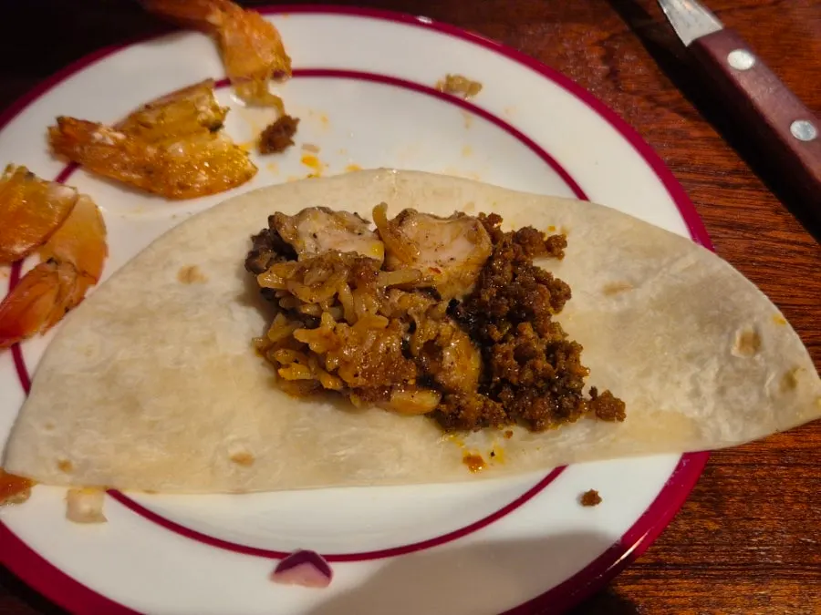 A thin layer of crispy rice on the bottom of the fajita skillet