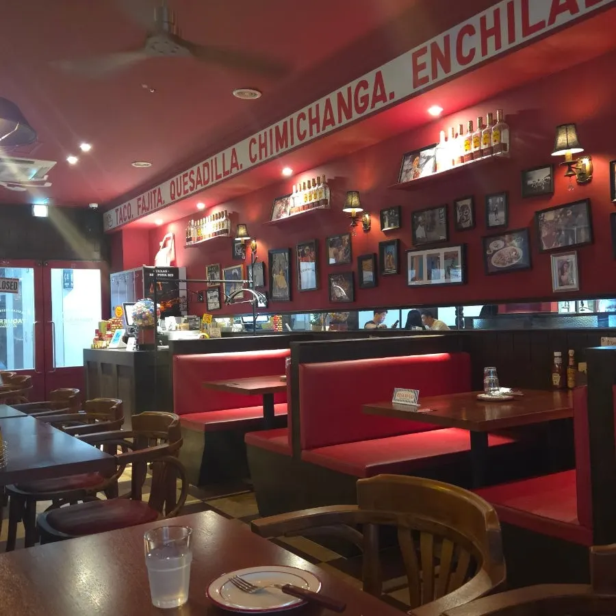 Interior of Taqueros with red casual decor