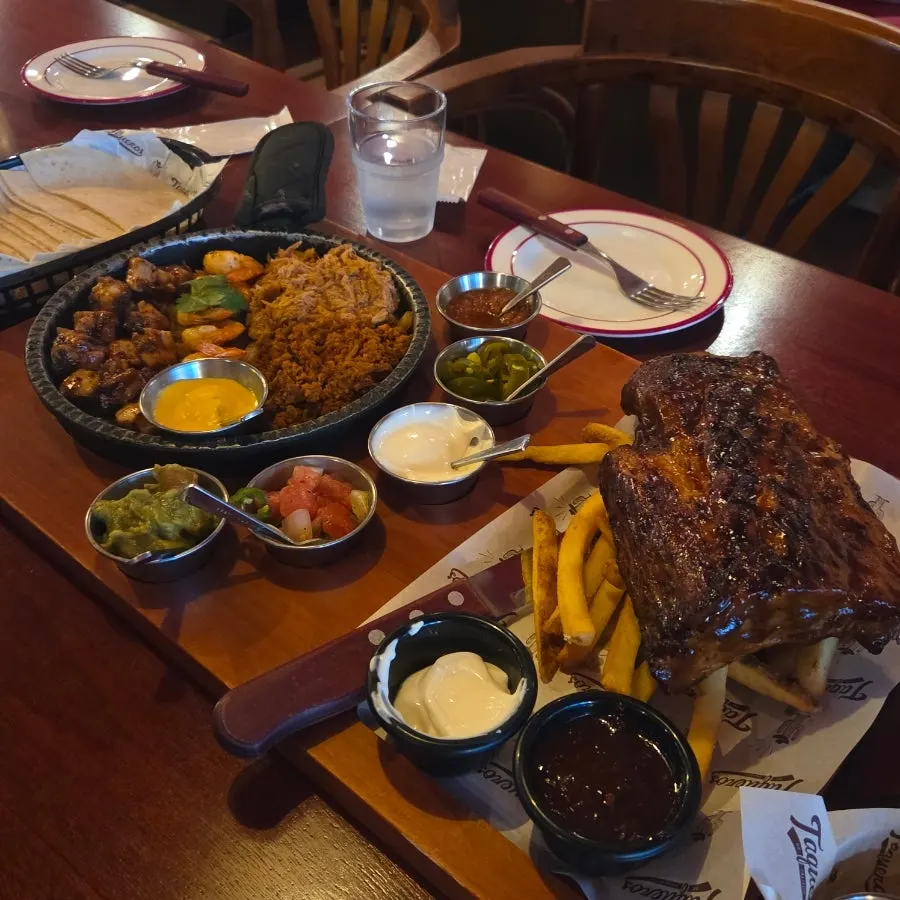 Table spread of Taqueros' 4-person set and chimichanga