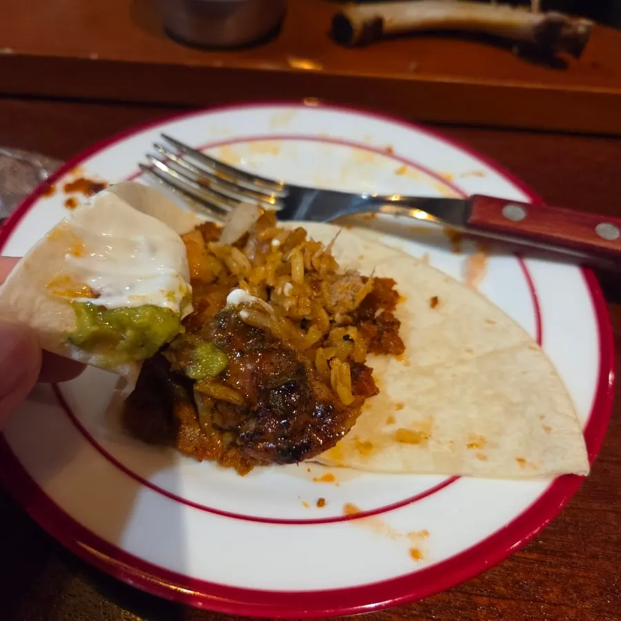 Fajita meat and shrimp on a sizzling platter