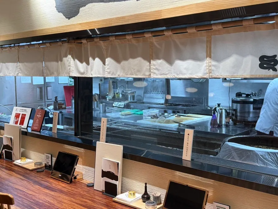 Open kitchen visible from inside the restaurant