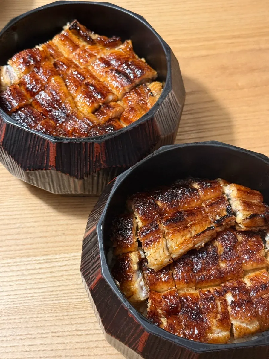Hitsumabushi eel rice bowl served in a wooden container