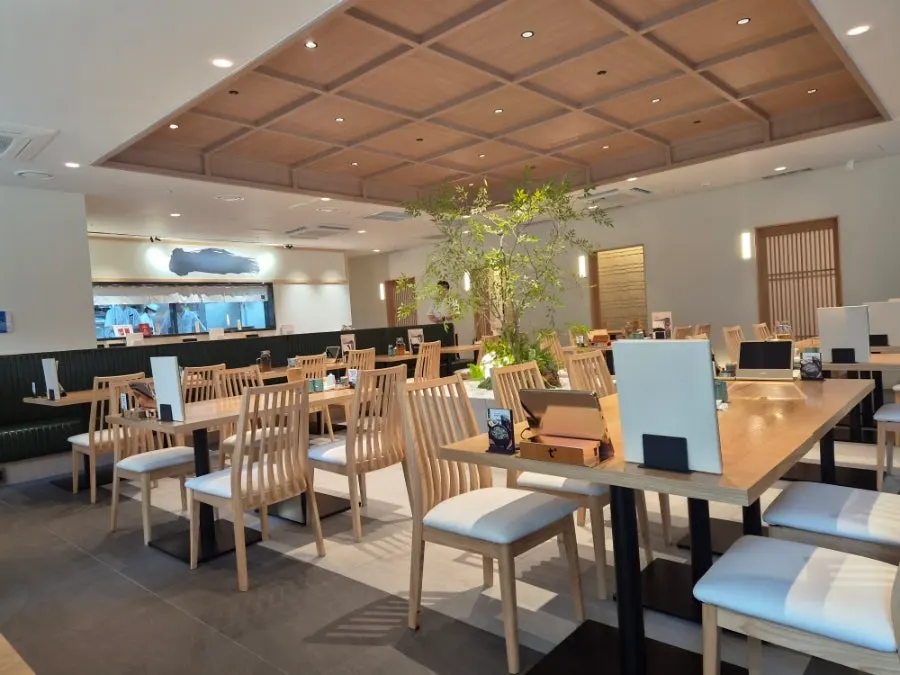 Interior of Kikukawa with wood-toned decor