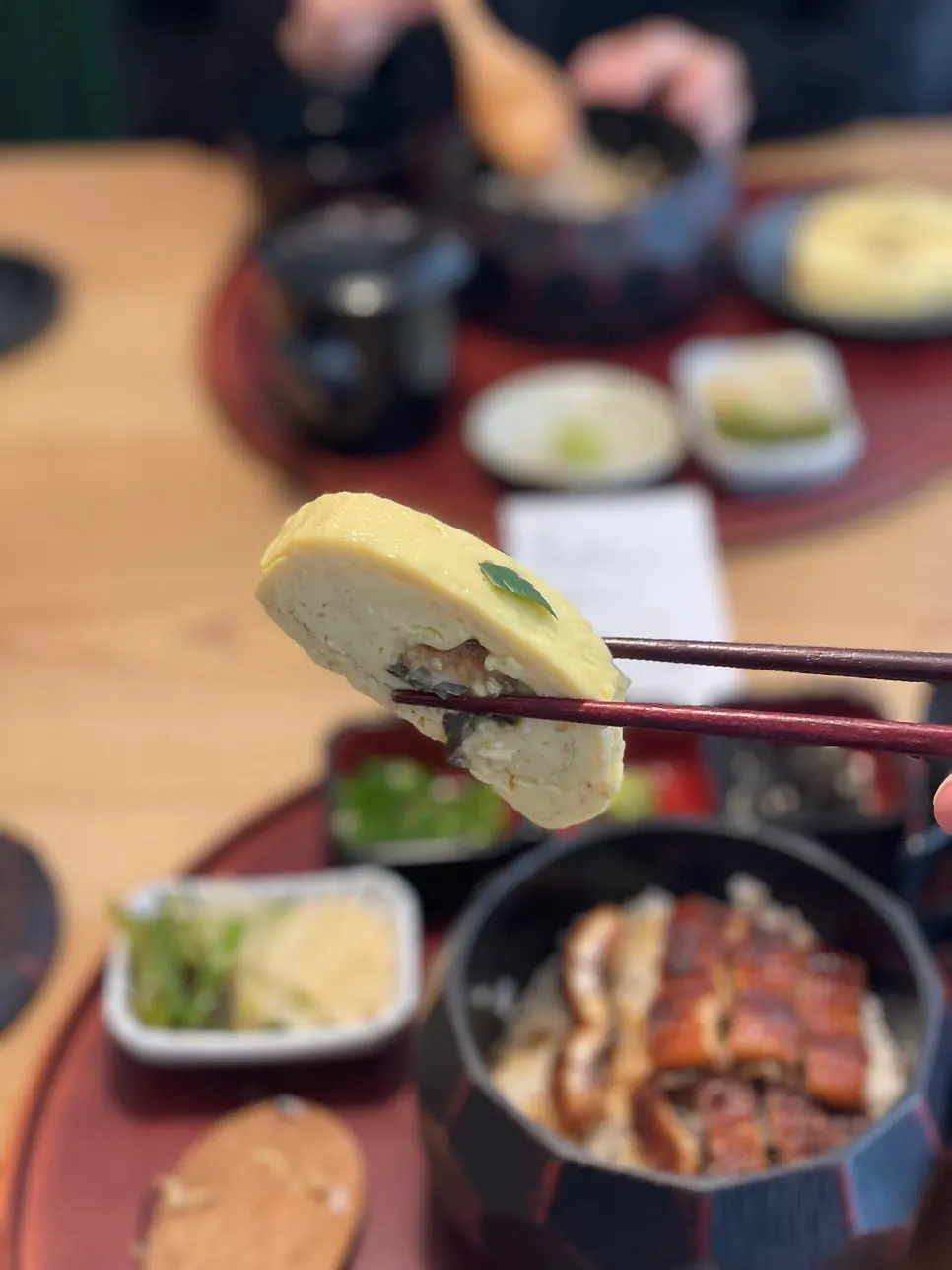 Hitsumabushi topped with scallion, fresh wasabi, and seaweed flakes