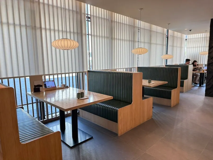 Deep green window booth seating