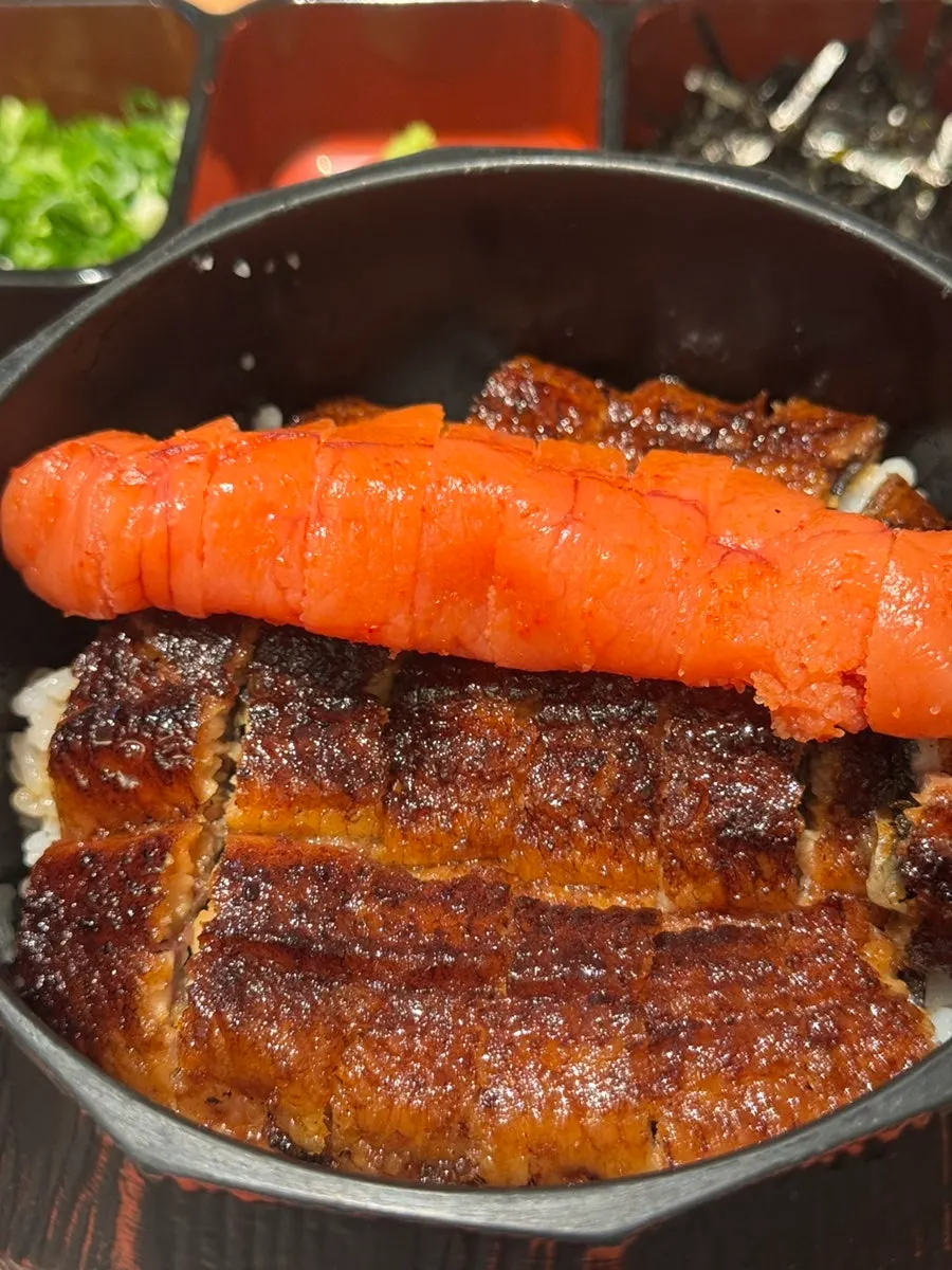A bite of charcoal-grilled eel over rice