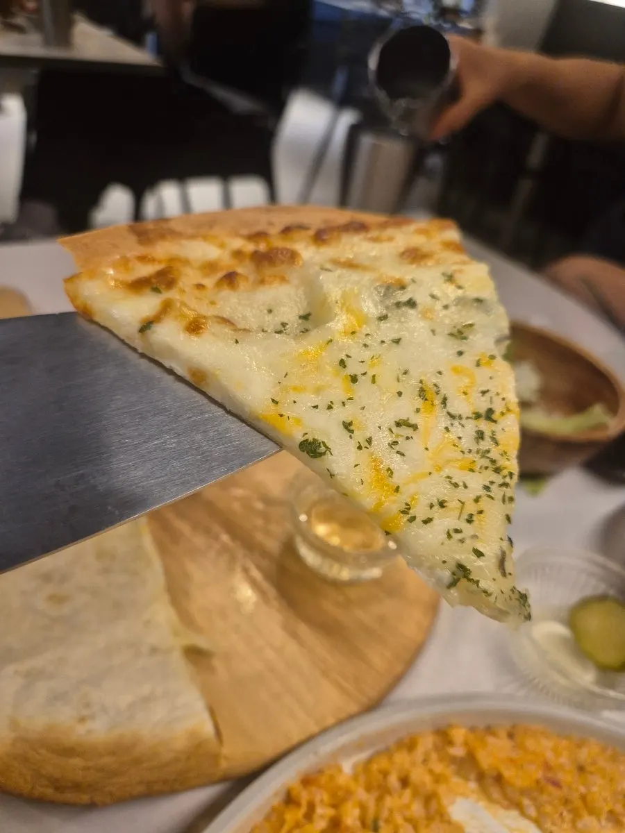 Thin-crust gorgonzola pizza and honey