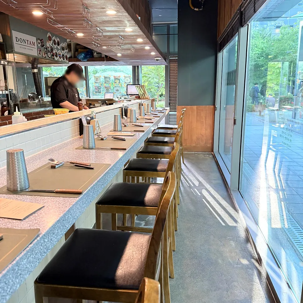 Bar seats at Don Tamguso facing the kitchen