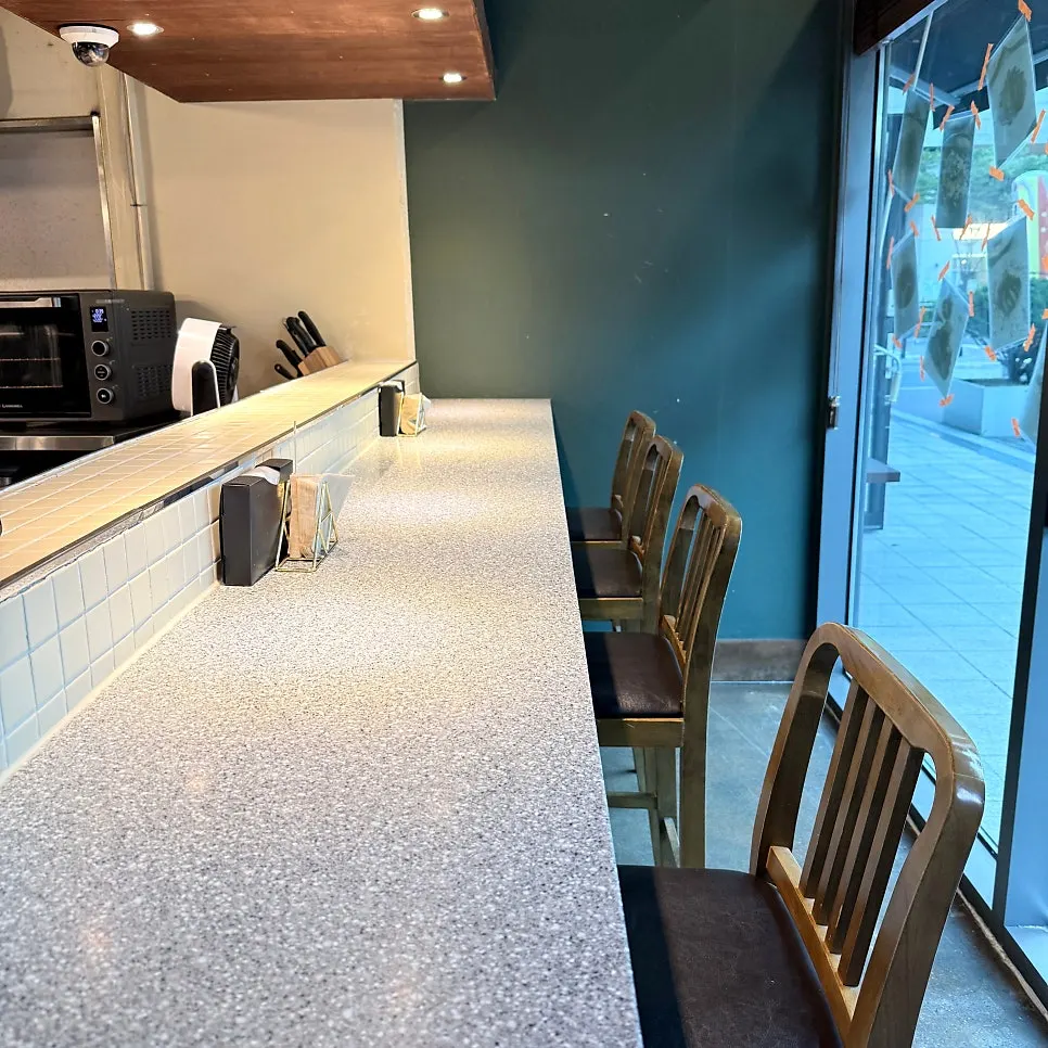 Bar seats and open kitchen at Don Tamguso