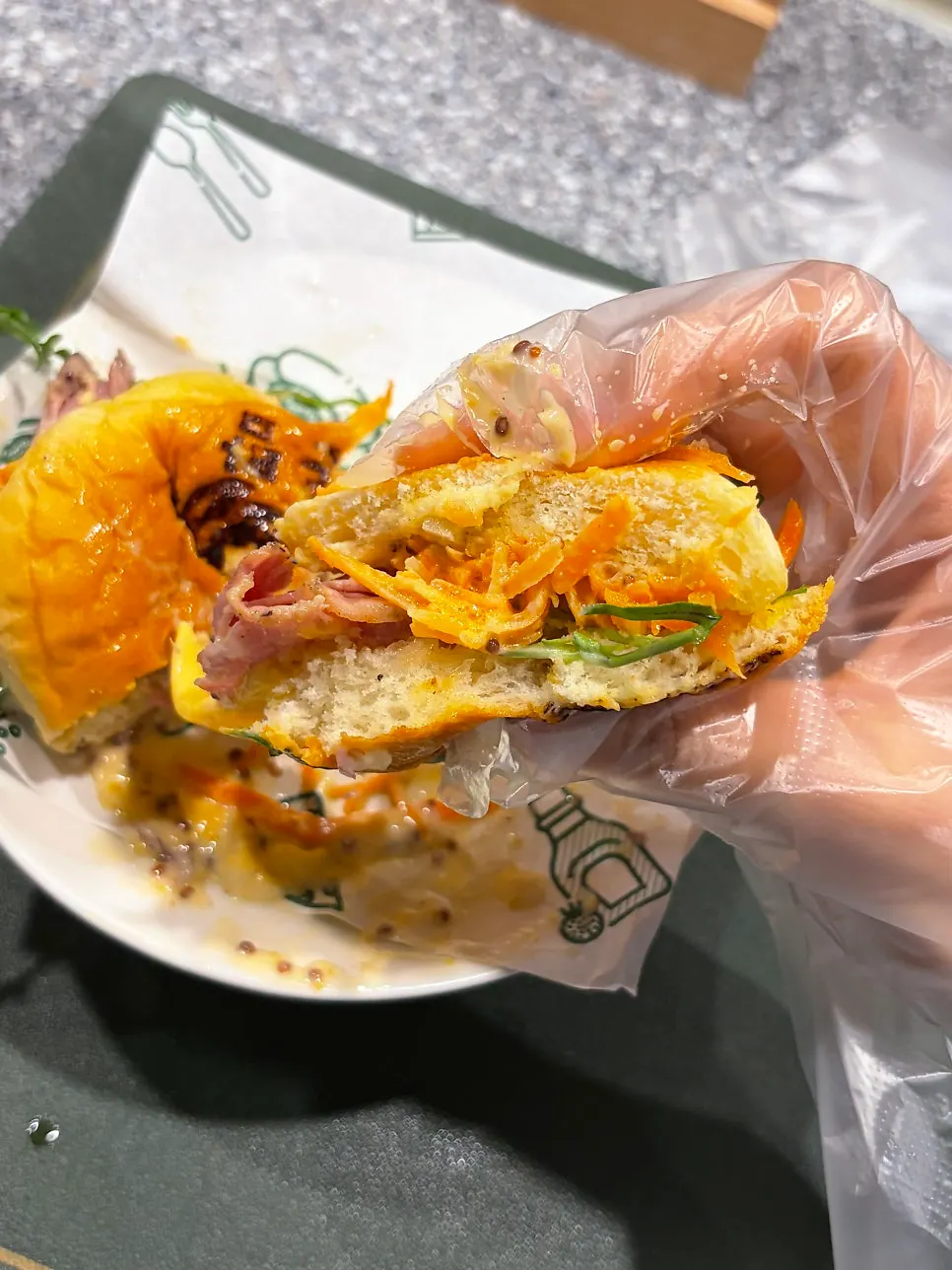 Cross-section of the burger showing carrot slaw and arugula