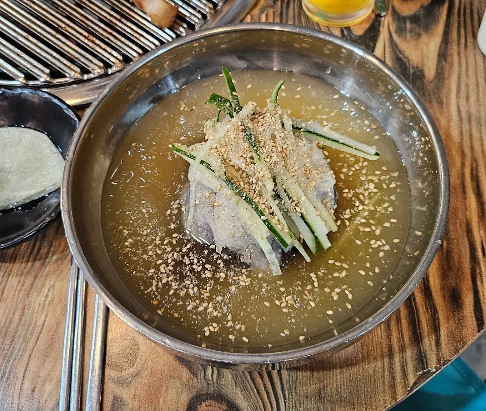 Naengmyeon served with ogyeopsal