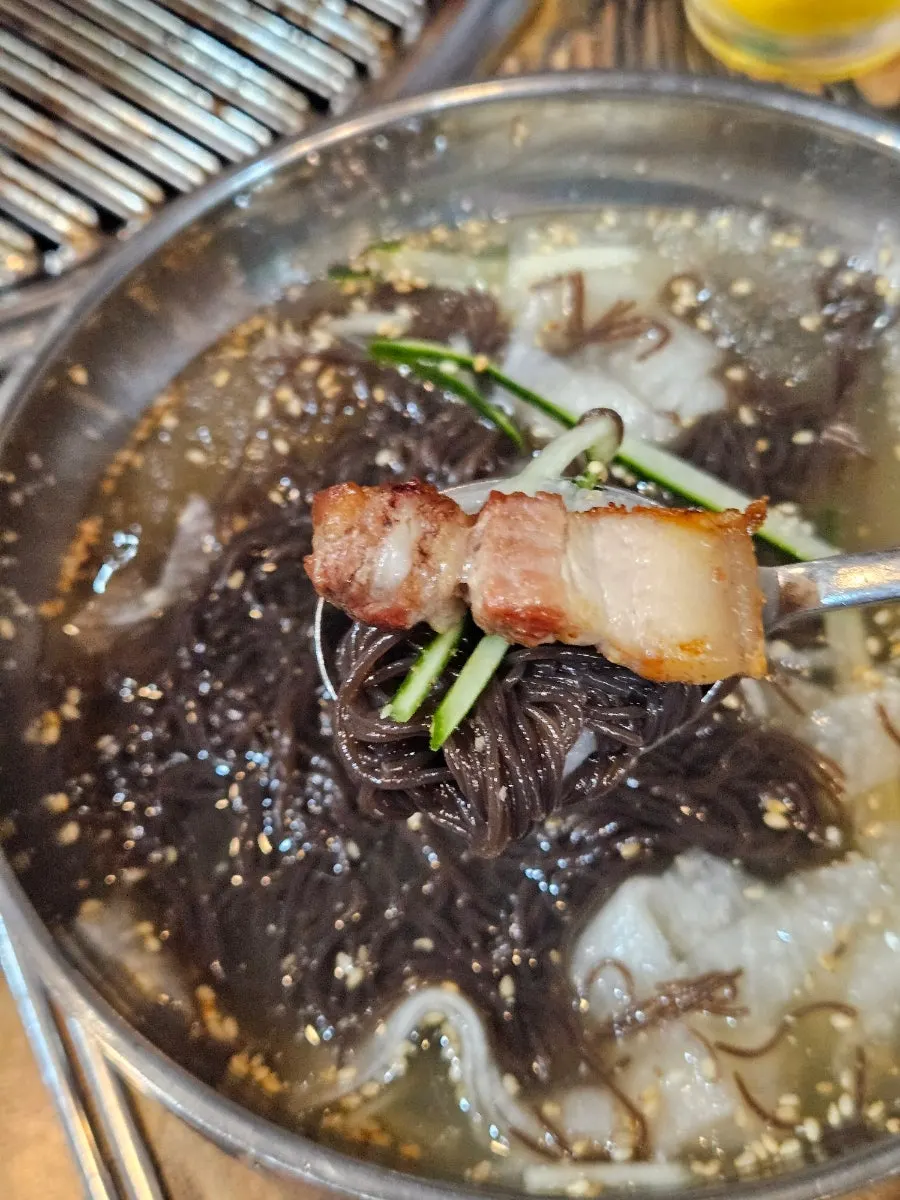 Naengmyeon broth with chewy ogyeopsal