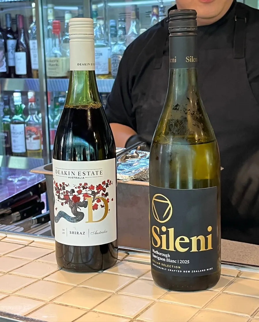 A glass of white wine from Don Tamguso's wine pairing