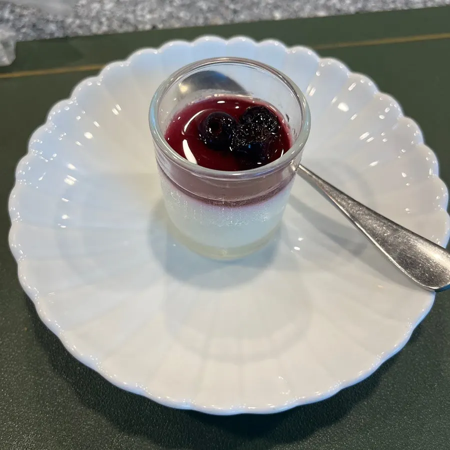 Pudding dessert topped with blueberry compote