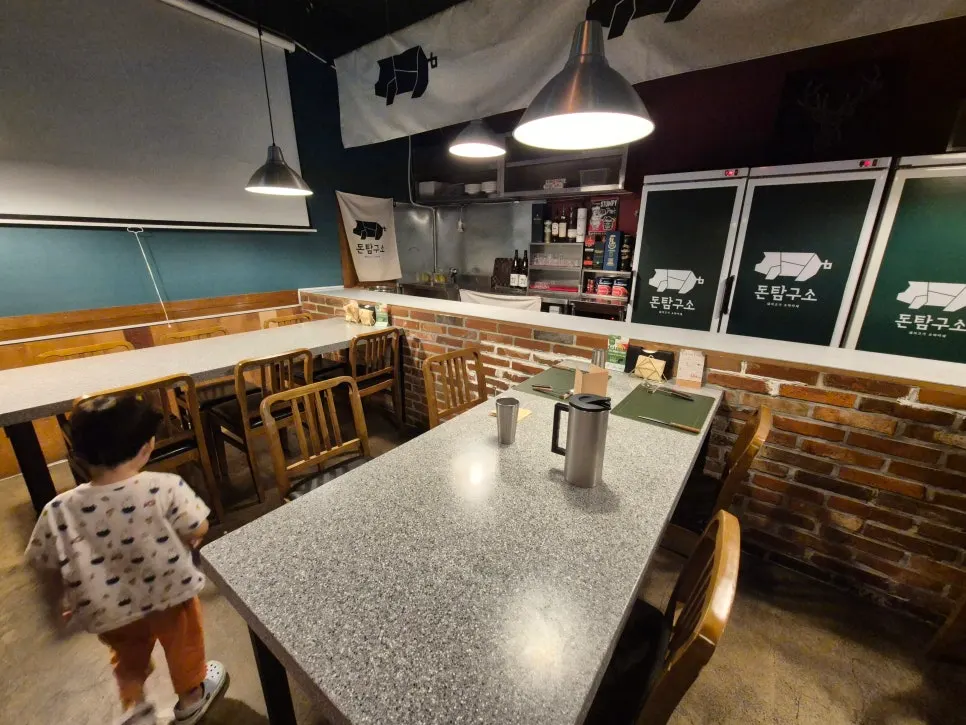Interior of Don Tamguso with counter seating and a table further inside