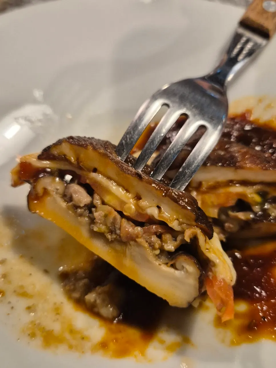 Cross-section of lasagna with house-made smoky barbecue sauce