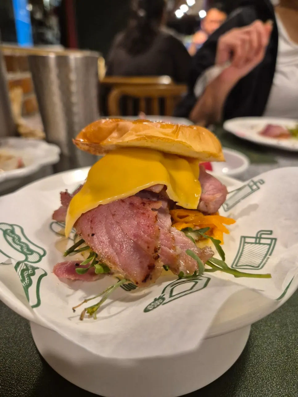 Signature hand-made burger with house jambon and carrot slaw