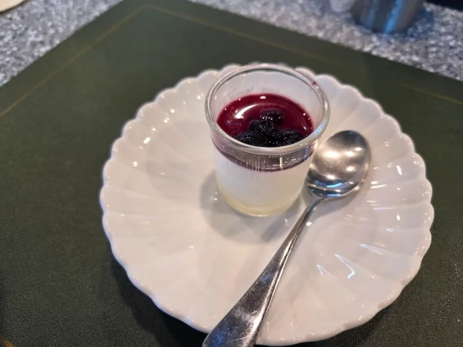 Scooping a spoonful of the milk pudding dessert