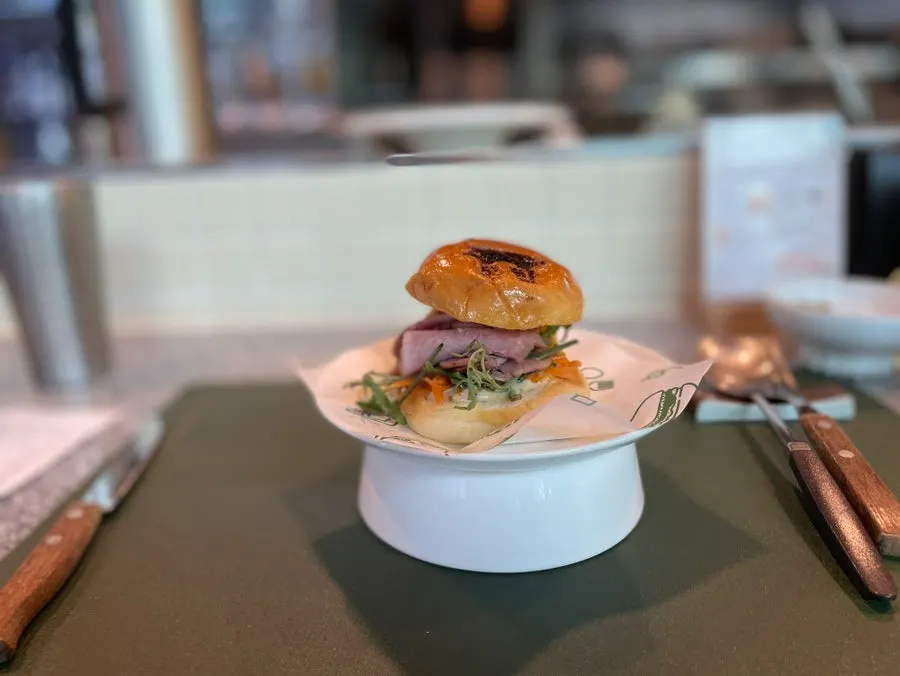 The signature burger with a glossy bun
