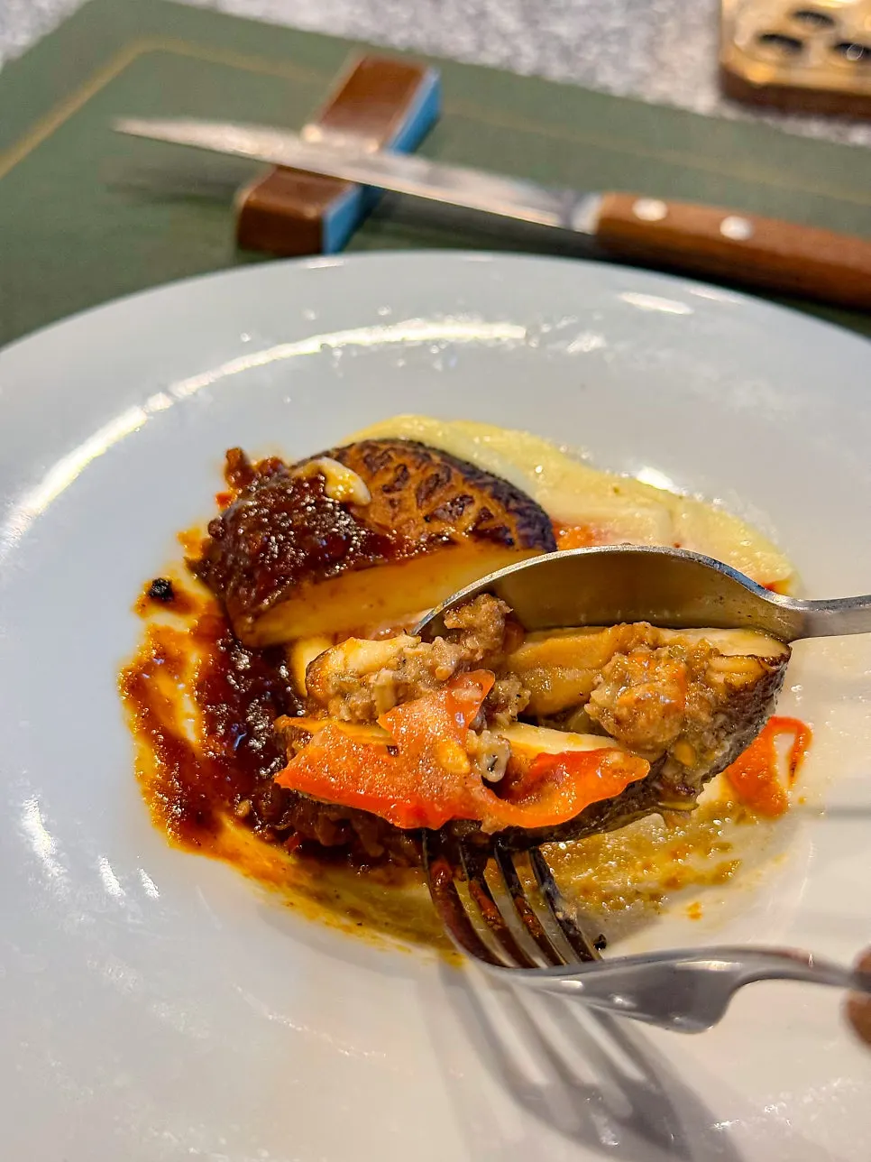 Cross-section of lasagna with white ragu sauce