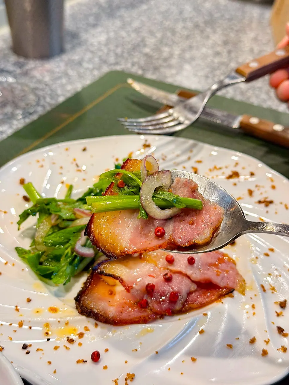 Minari salad served alongside the pork belly