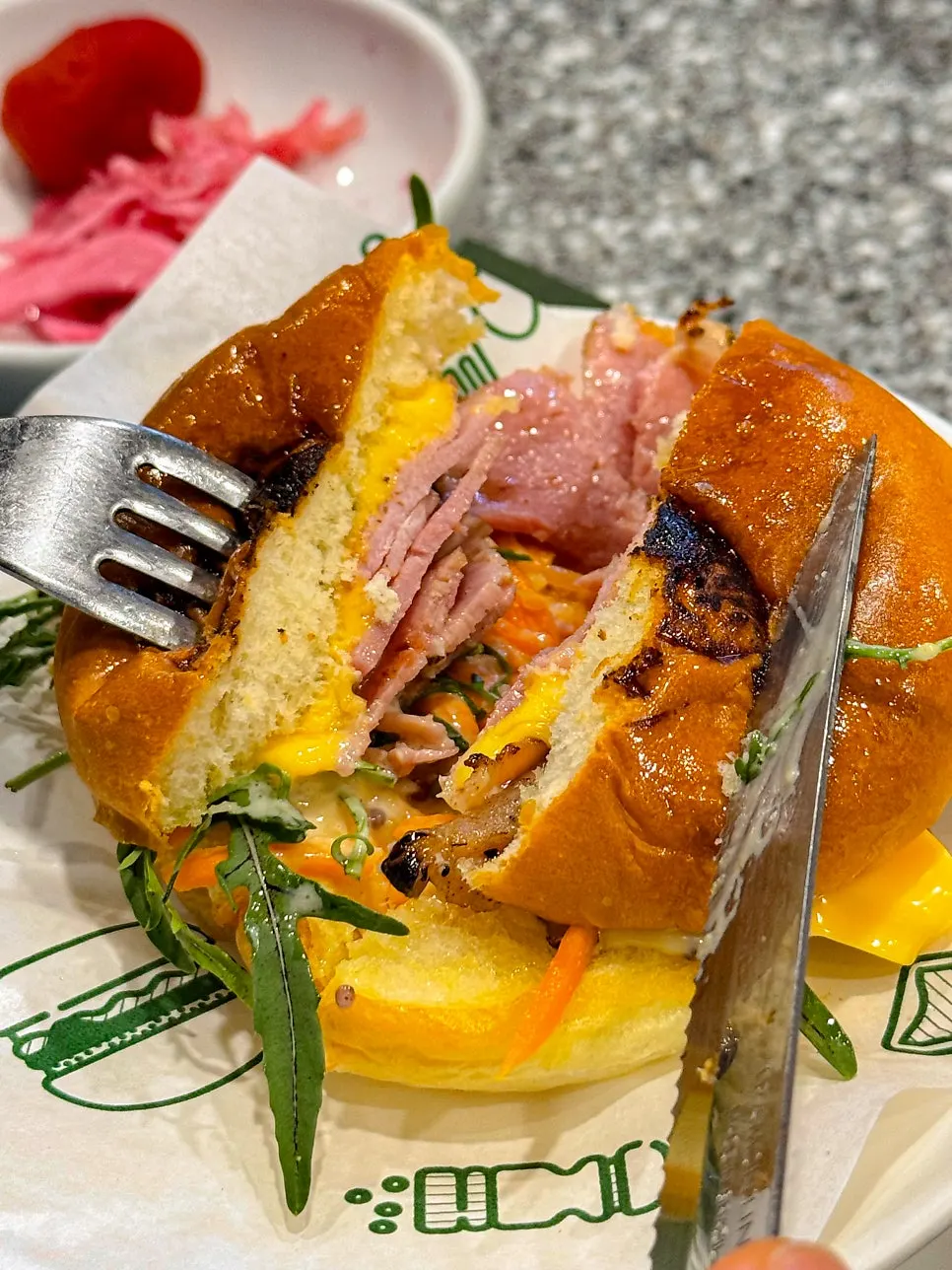 Cross-section of the burger with jambon and arugula