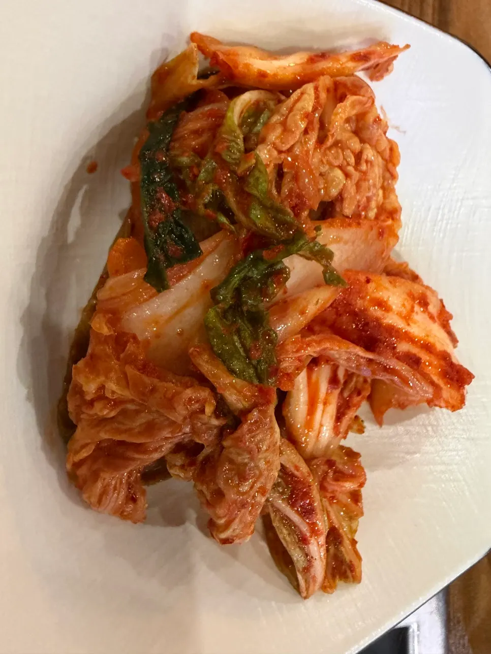 Fresh geotjeori kimchi served as part of the basic table setting