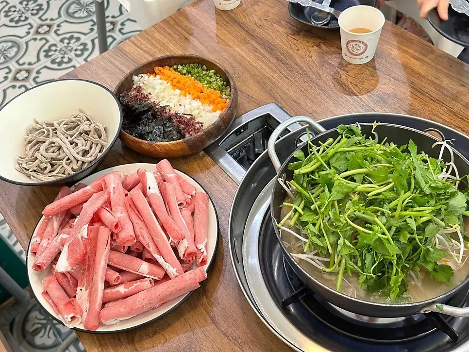 Table setting with perilla broth shabu-shabu