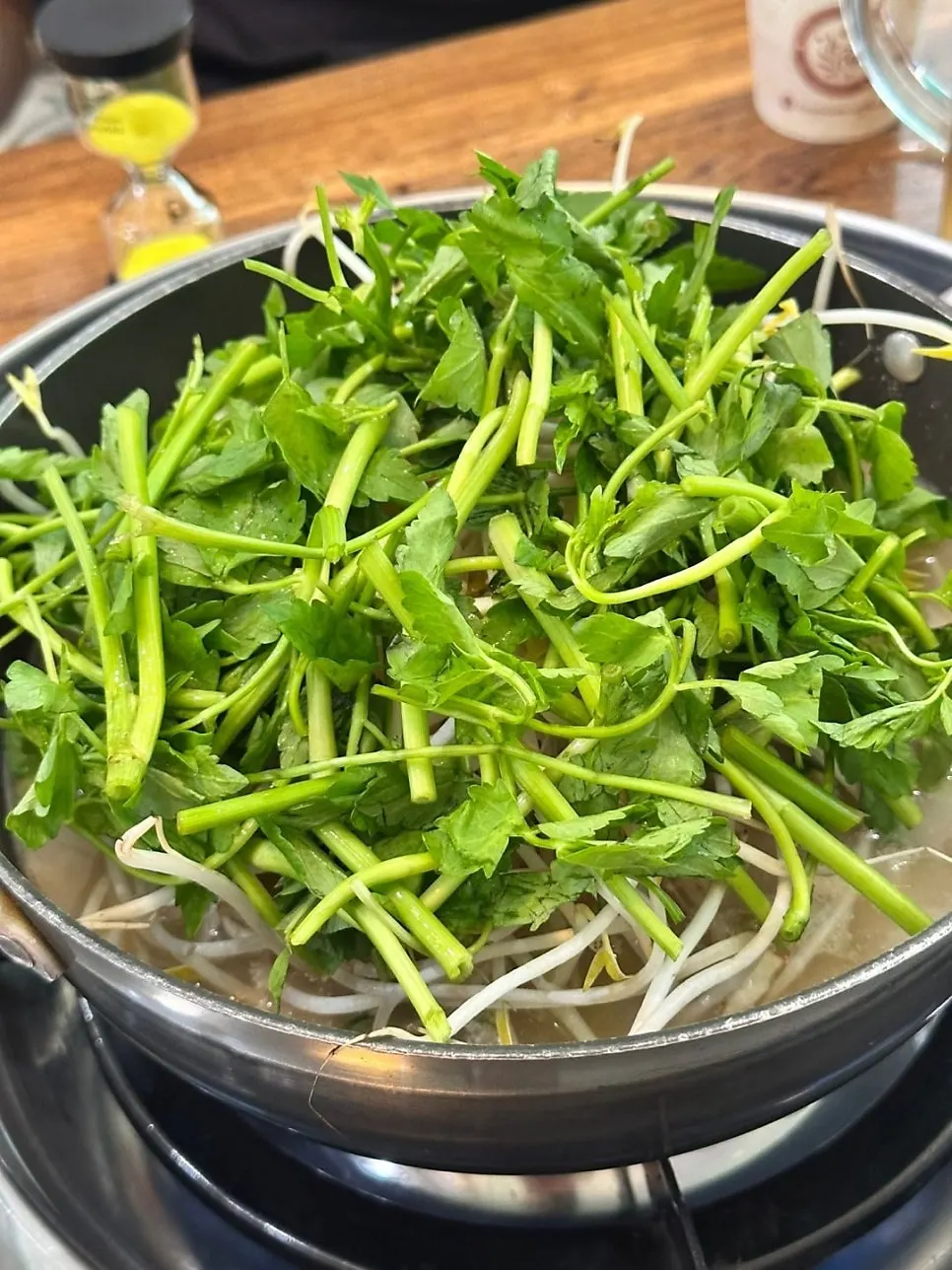 Pot of boyang hanbang broth with Korean beef bone stock and perilla