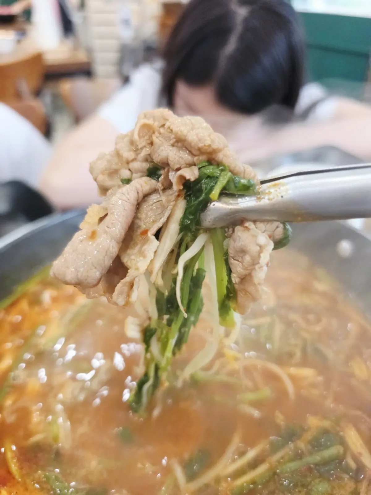 A tender, cooked piece of shabu meat