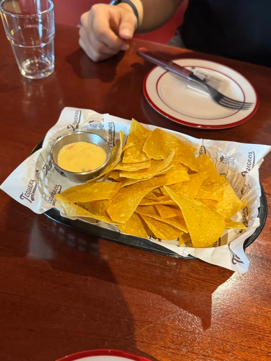Default nacho chips with cheese dipping sauce