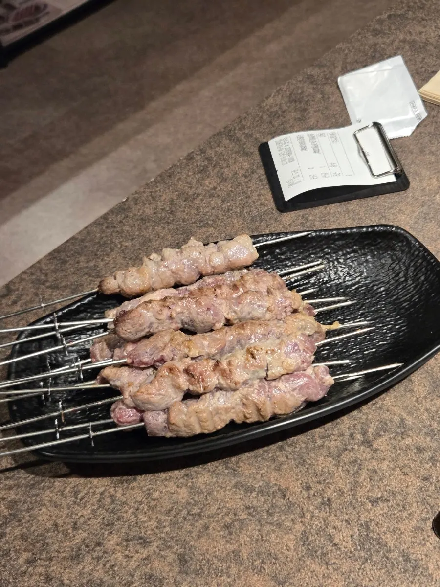 Par-grilled thick lamb skewers