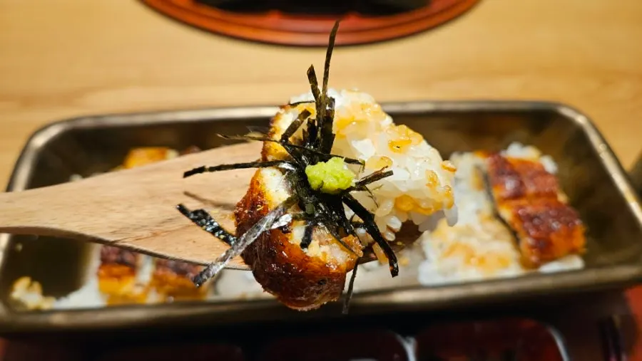 A scoop of rice and eel together