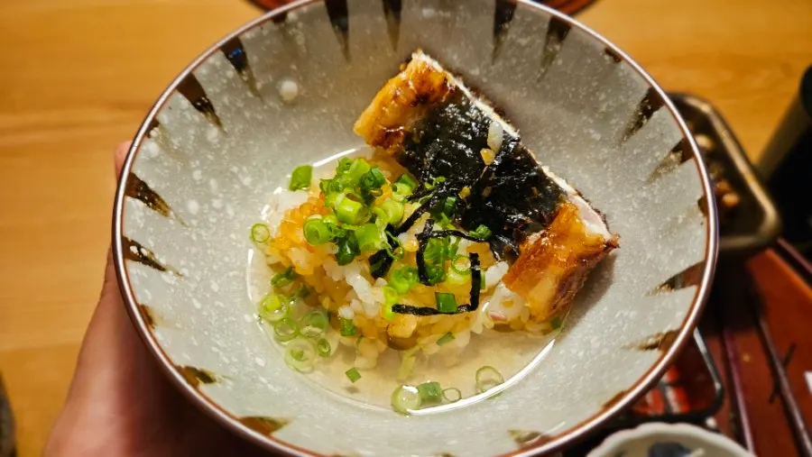 A bite of eel with clear dashi broth