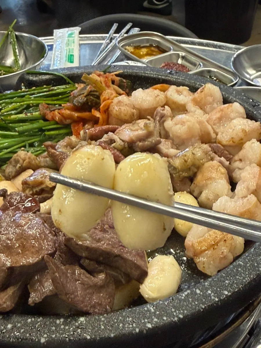 Nicely browned gopchang alongside cheese tteok