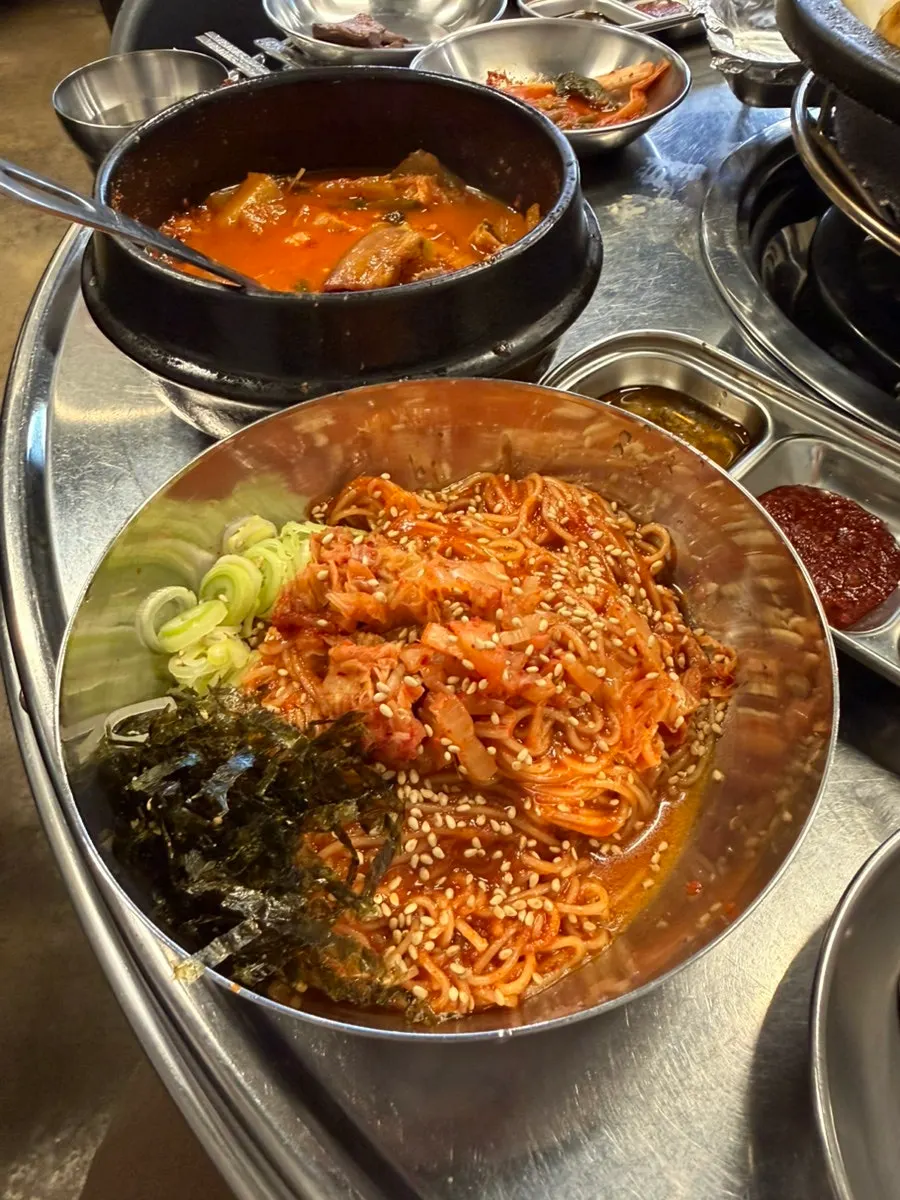 Tangy, sweet bibim noodles served with the gopchang